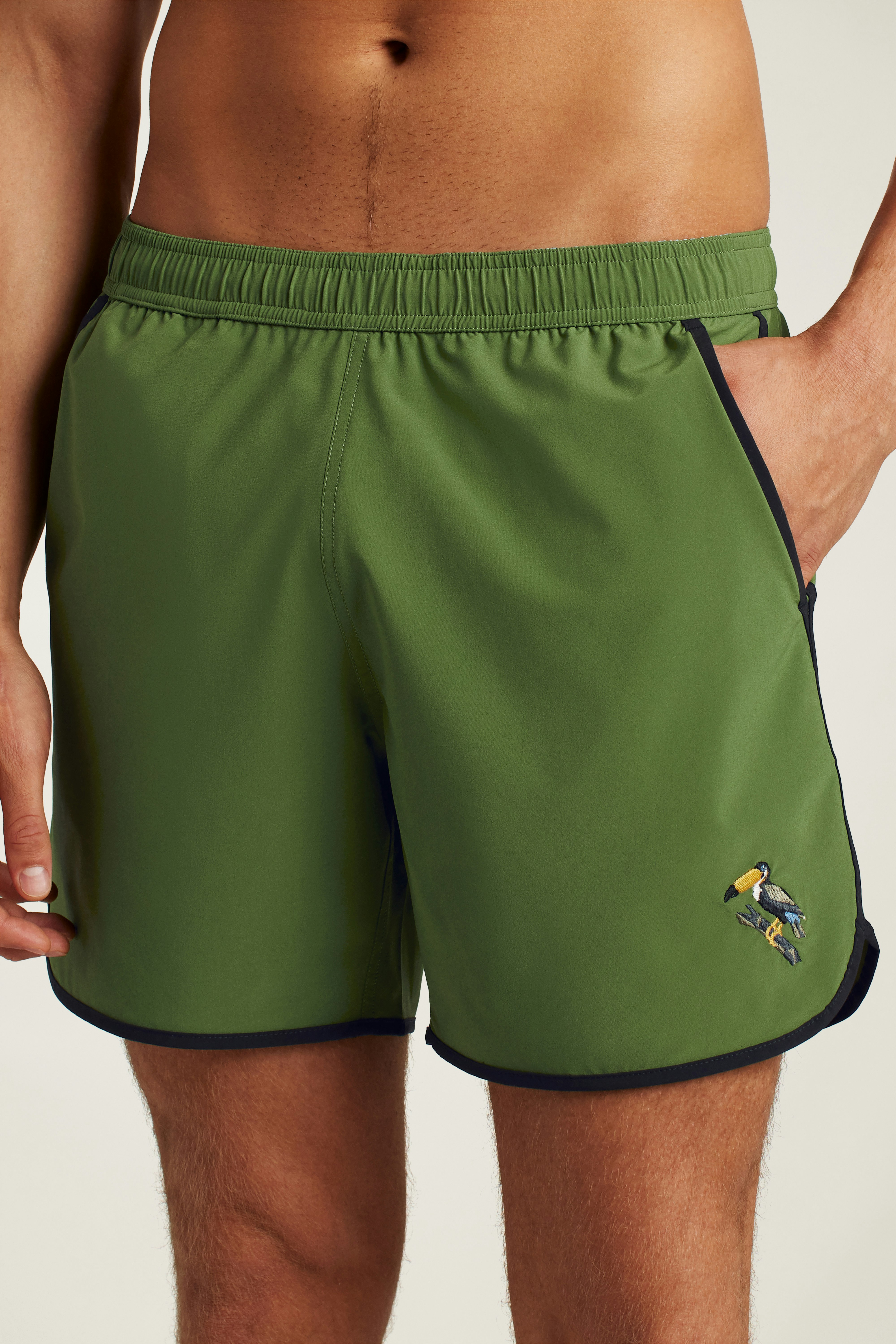 Throwback Swim Trunks green toucan embroidery